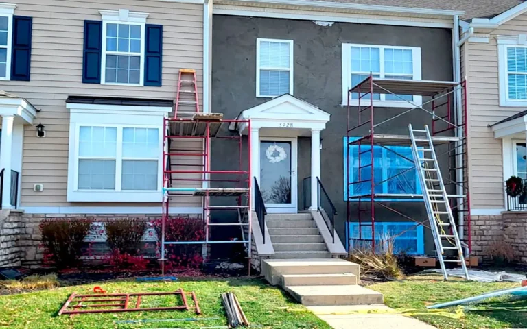 Exterior home facade during the stucco application process