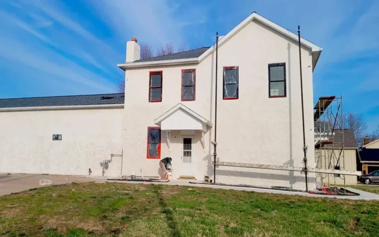 Front wall with decorative stucco architectural details