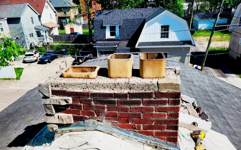 Professional chimney repair including crown restoration and brick repointing for a damaged residential chimney.